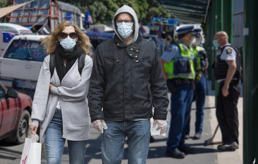 couple walking past protests with masks on