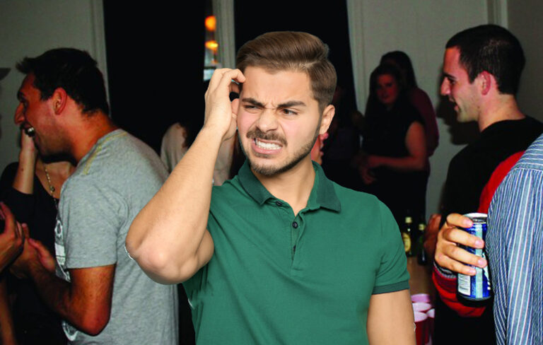 man looking nervous at party