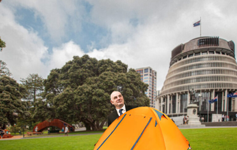 Trevor Mallard poking his head out of a tent on parliament grounds