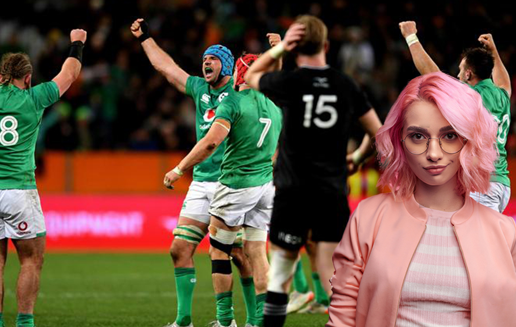 Pink haired woman smirking with All Blacks loss in the background