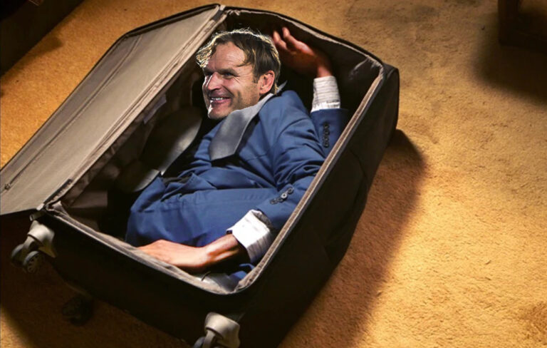 Scott Robertson in suitcase