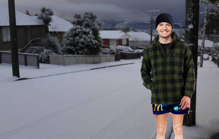 man in shorts in snow