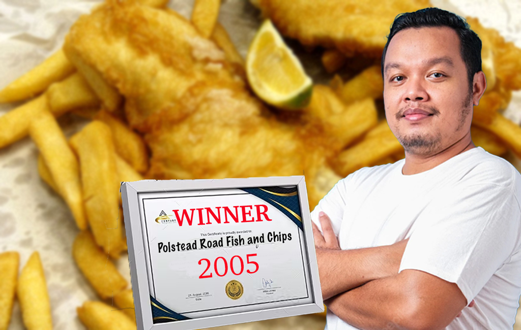 man with fish and chip award