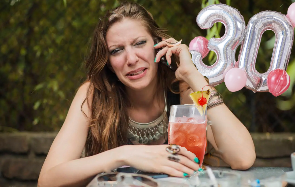 woman crying with cocktail and 30th birthday balloons