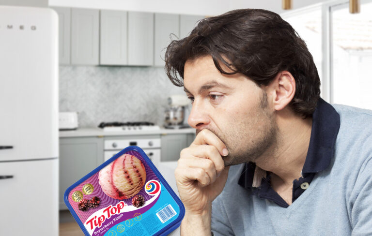 disappointed man looking at boysenberry icecream