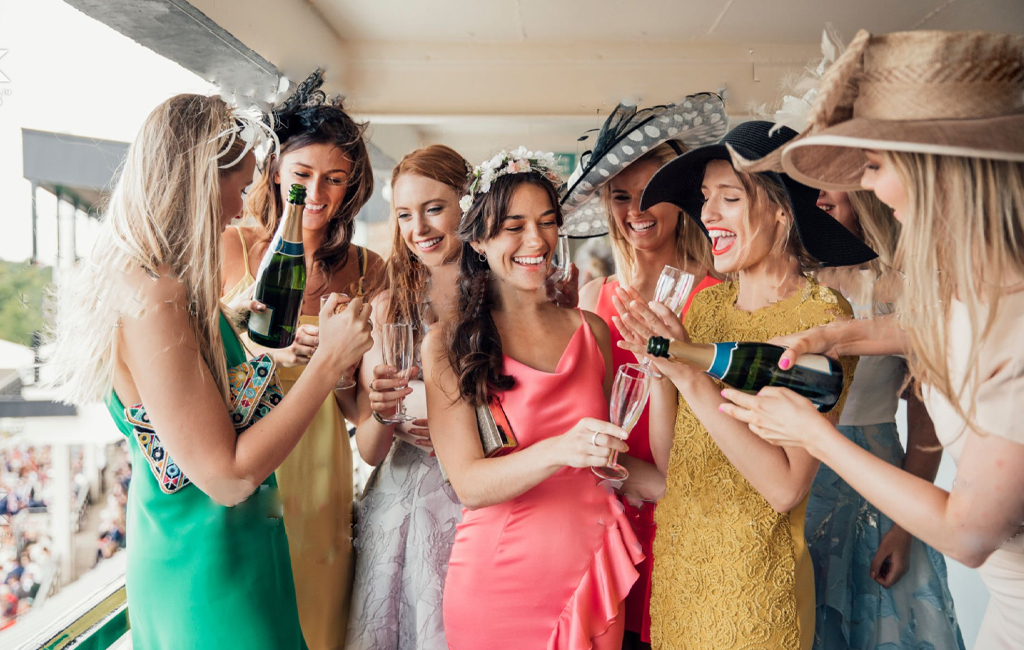 ladies drinking champagne at the races