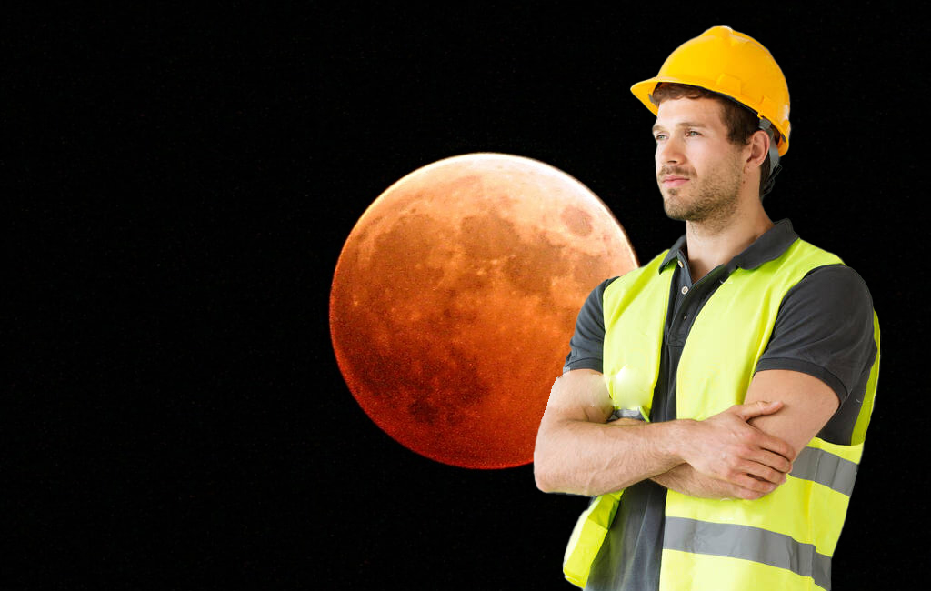 Man in hi vis with red moon in background