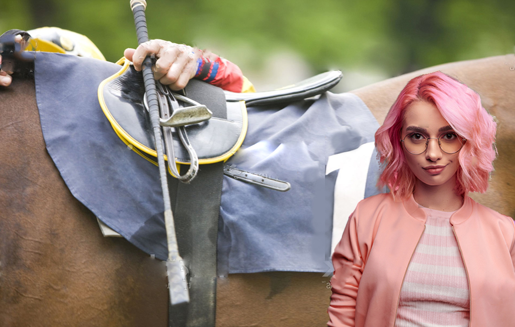 Pink haired woman in front of horse that jockey is about to mount with whip