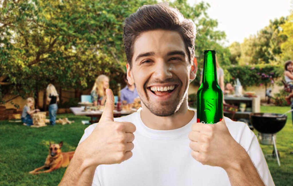 man giving thumbs up with beer at bbq