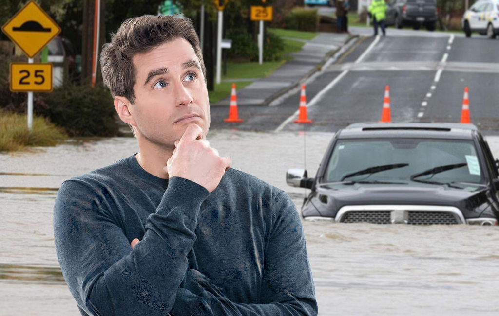 man in front of flooded road