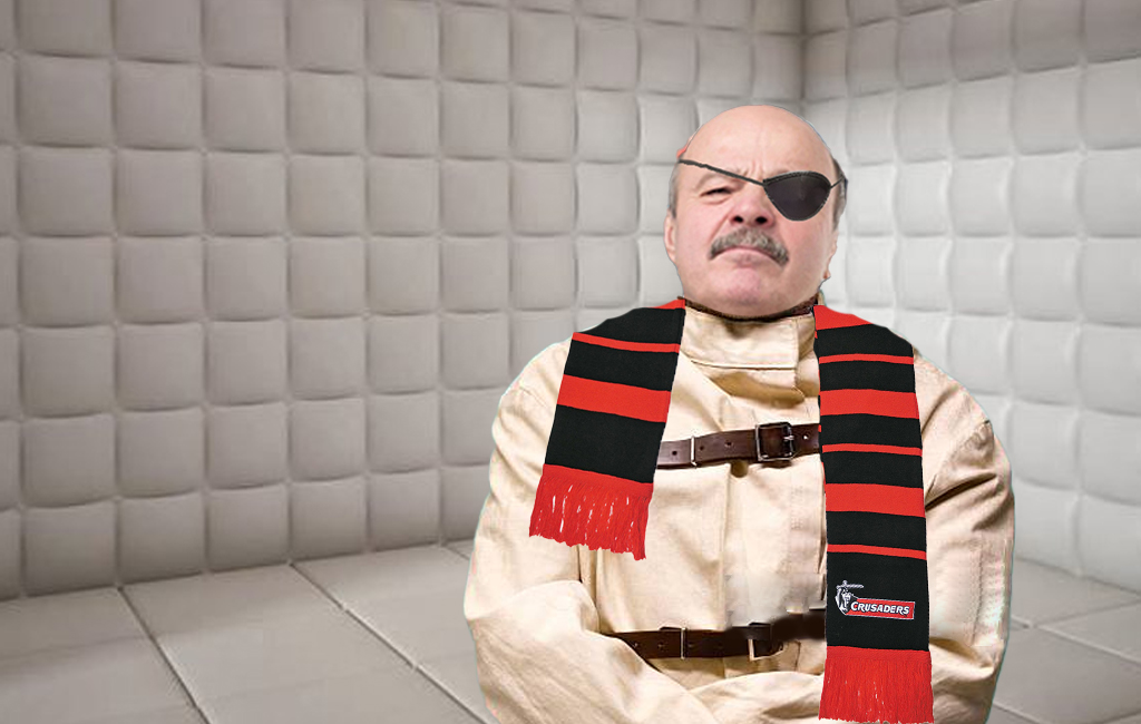 one eyed cantab Craig Chamberlain in a padded room in a straight jacket.