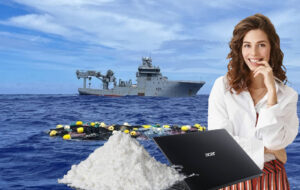 woman looking sheepish next to laptop and cocaine with floating shipment of cocaine in background next to navy ship