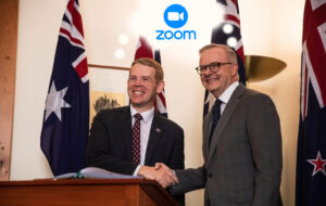 Chris Hipkins and Anthony Albanese shaking hands and thinking about Zoom
