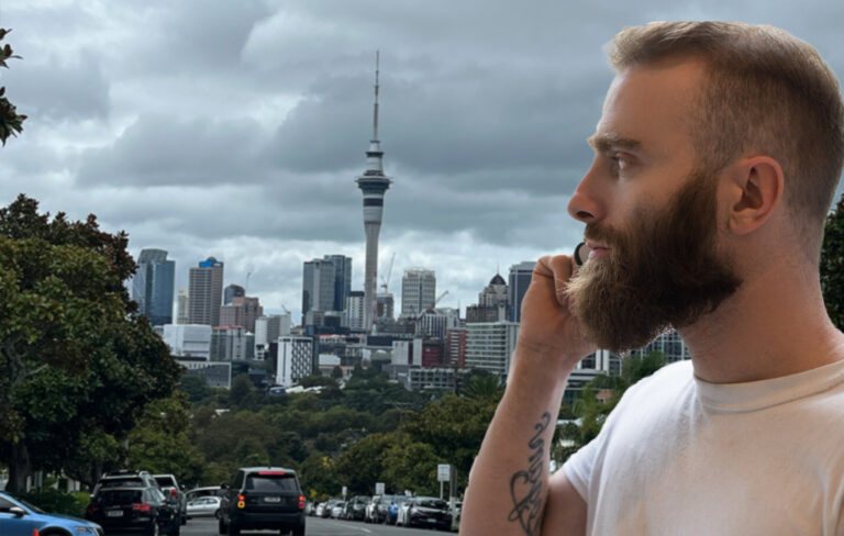 Man looking at auckland sky tower