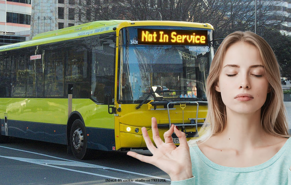woman tries to remain calm as bus drives past not in service.