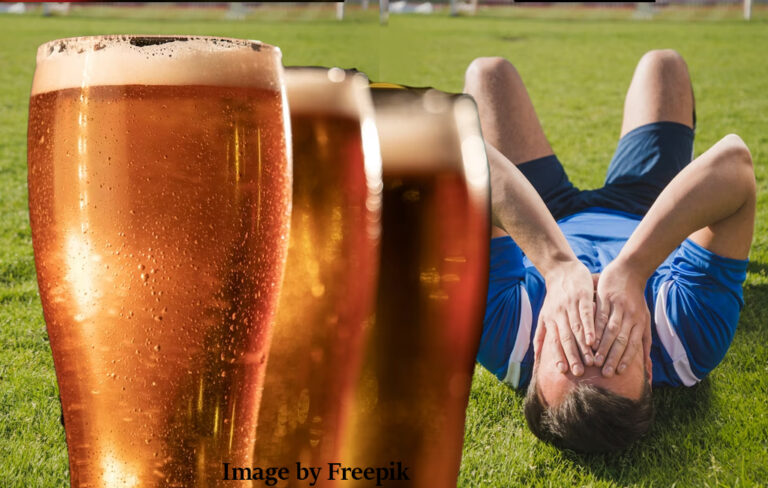 beers with crest-fallen football player on the ground.