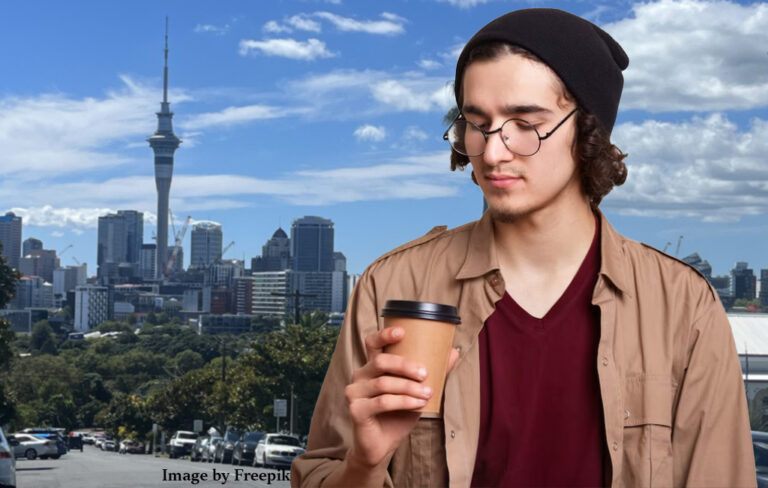 hipster guy in auckland looking down his nose at coffee.