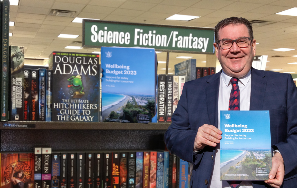 grant robertson with his budget in the sci fi fantasy section of the library.