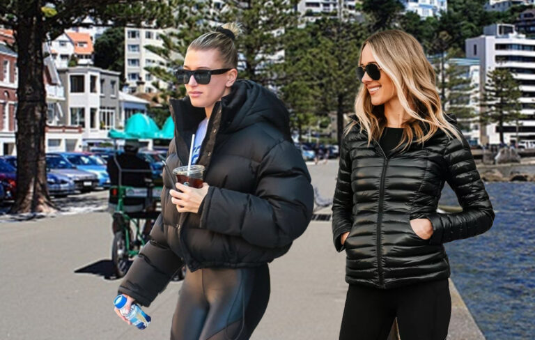 two women on oriental parade, Wellington, wearing puffer jackets.