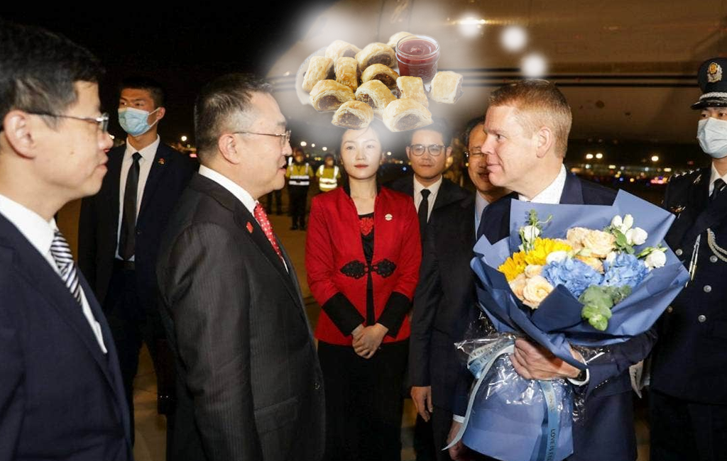 chris hipkins meeting with chinese foreign minister but thinking about sausage rolls.