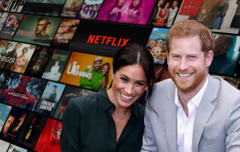 harry and meghan in front of netflix branding.