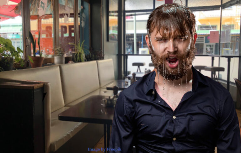 dripping wet man in cafe