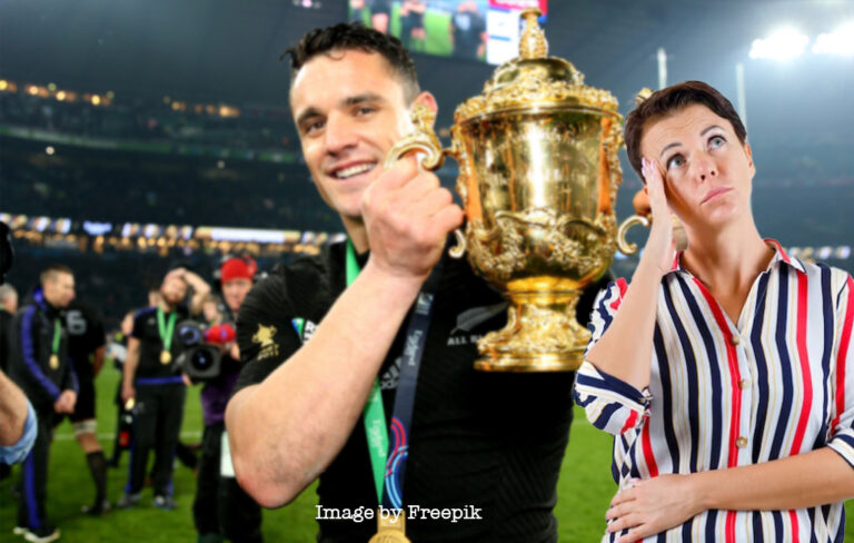 mum looking skyward with world cup winning dan carter in background .