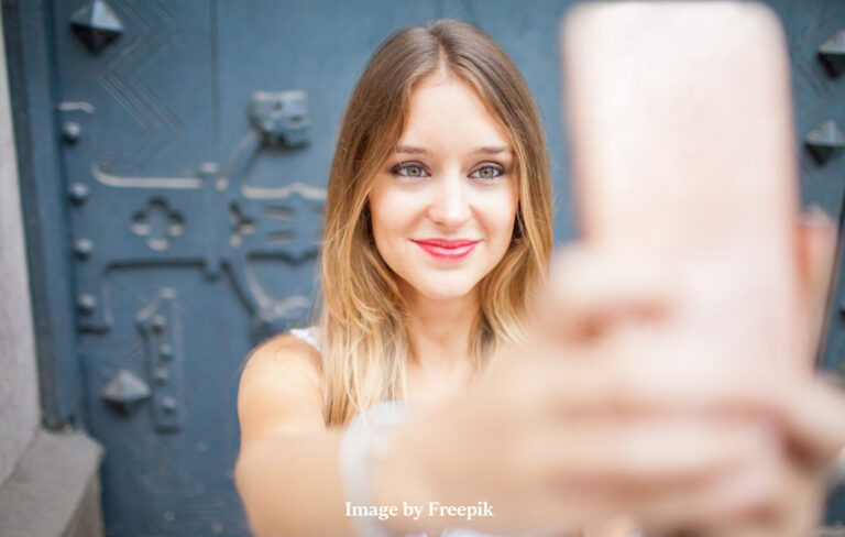 attractive young lady taking selfie