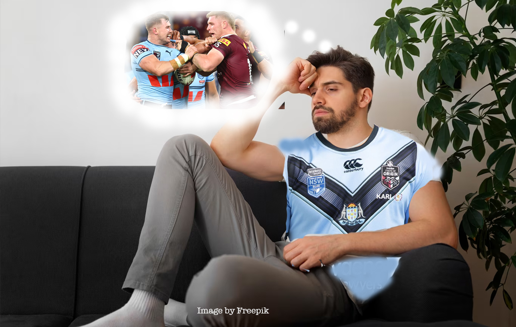 man on couch with nsw jersey thinking about origin 3.