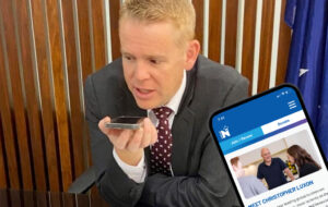 chippy hipkins checking out National website on phone