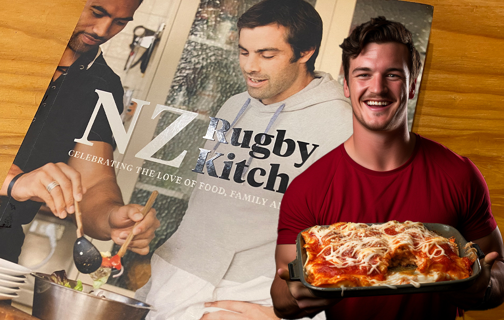 young bloke looking proud of his lasagne, with cook book in background