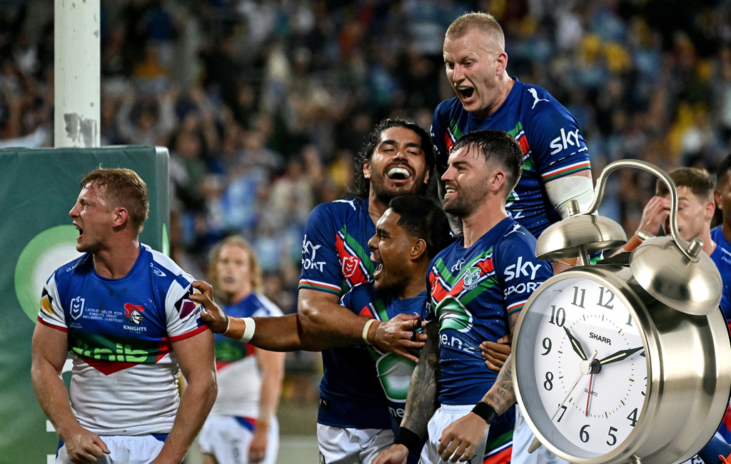 warriors celebrating with clock in foreground.