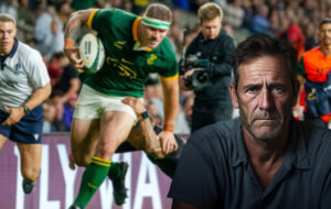 man with furrowed brow watching south africa beat the all blacks