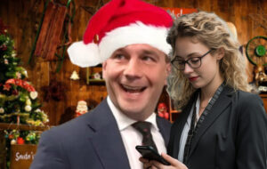 Woman in business attire looking at phone with David Seymour as santa in background