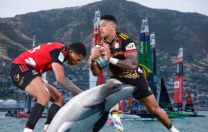 rugby players in front of dolphin and sail gp in water