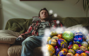 hungover looking man on couch thinking about easter eggs