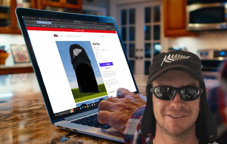 tim naki in front of laptop on ACC black flaps shop page