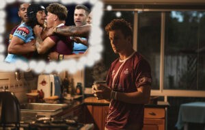 man in queensland shirt making coffee in kitchen at night, thinking about state of origin
