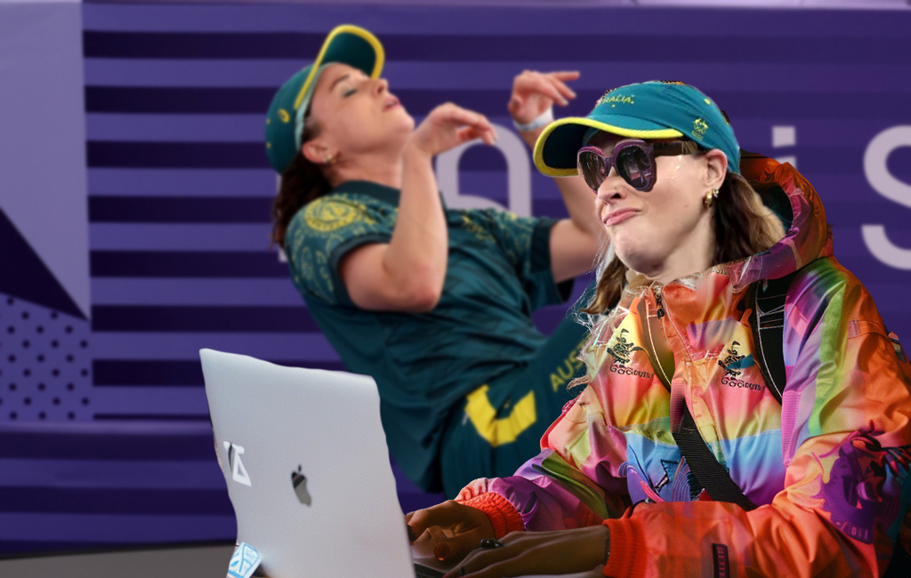 B-girl Raygun working on laptop with her Olympic perfomance in the background