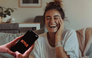 embarassed woman on the couch with phone with netflix in the foreground