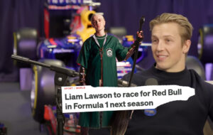 Liam Lawson with red bull car and pic of Draco Malfoy