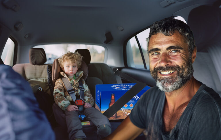 beer box strapped into car seat next to kid in car seat with proud dad in the front