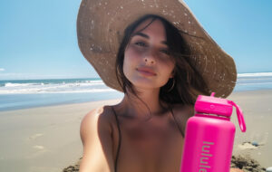 woman taking selfie on beach