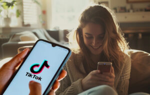 woman on couch looking at tiktok