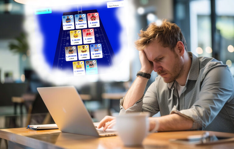 stressed man looking at laptop thinking about fantasy rugby