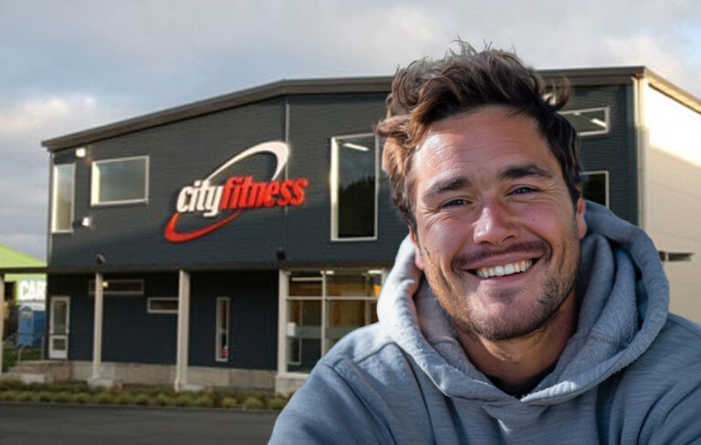 man smiling outside city fitness