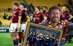 proud highlanders fan in front of losing team.