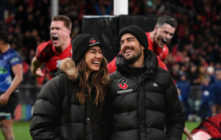 crusaders fans at game wearing black puffer jackets and beanies