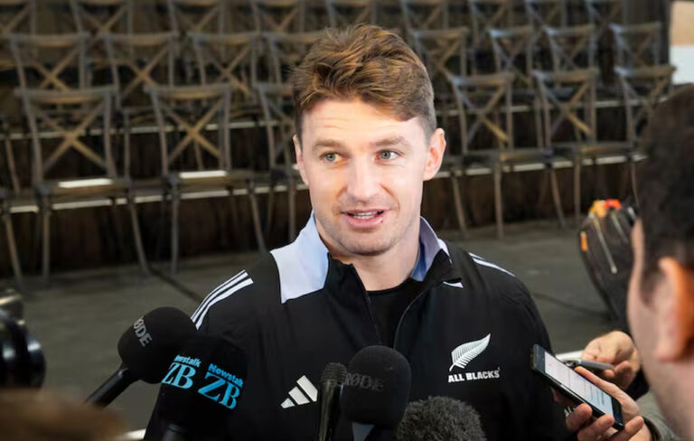 Beauden Barrett fronting media.