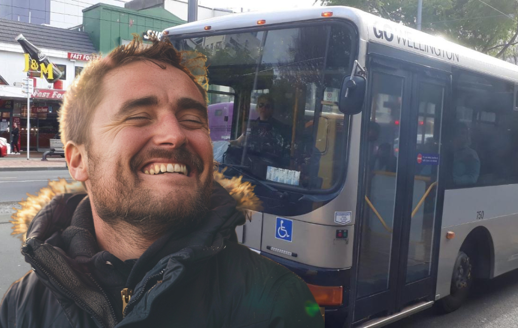 man sarcastically happy to see bus.